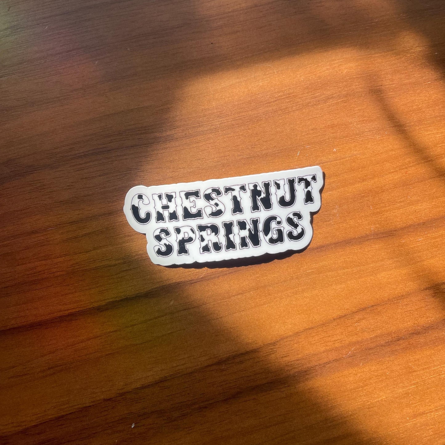 Chestnut Springs Cow Print Sticker