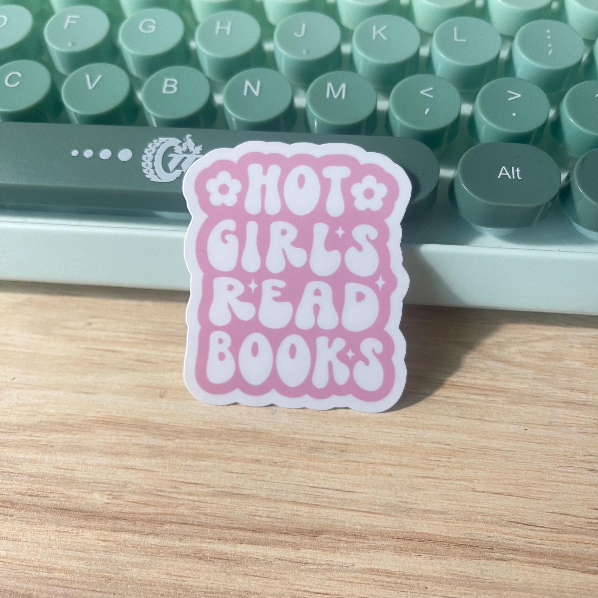 Pink sticker with 'Hot Girls Read Books' text 
