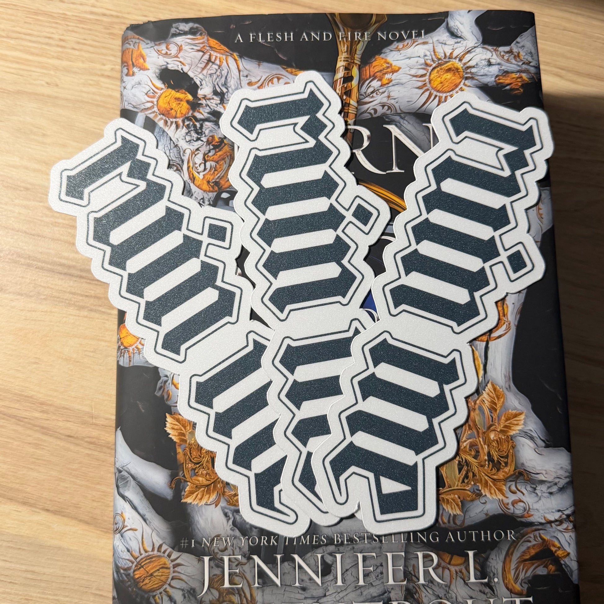 Die cut ruin me bookmarks on top of a book on  a table