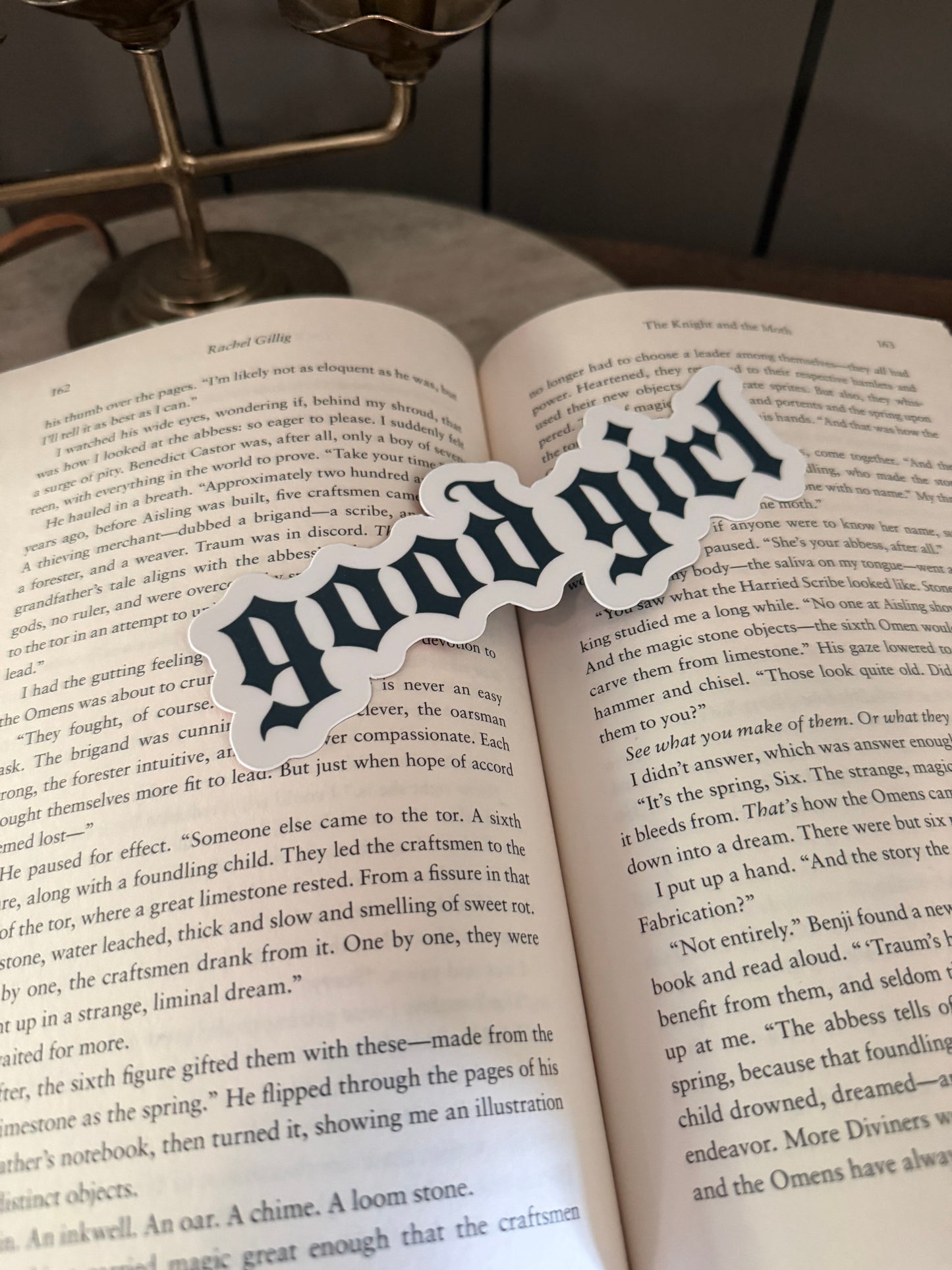 Decorative bookmark with text "good girl" on an open book
