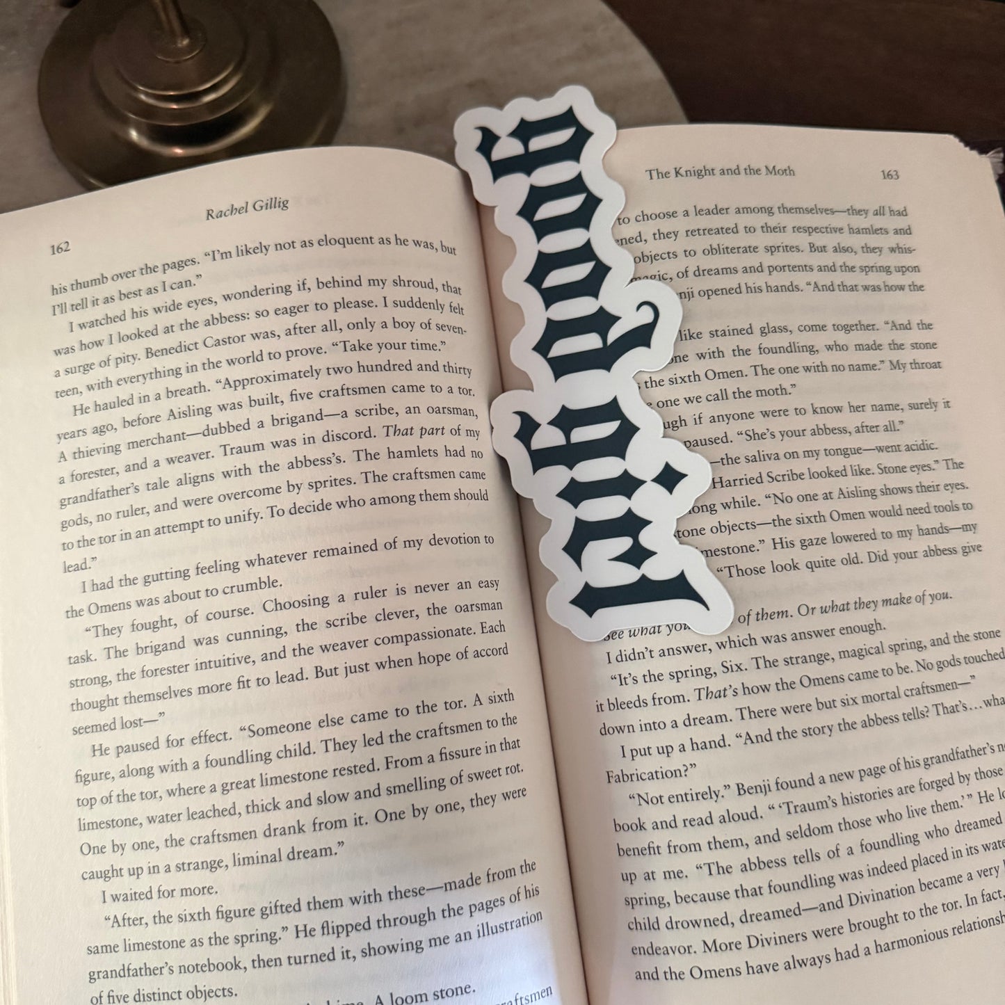 Bookmark with decorative 'good girl'  design on an open book