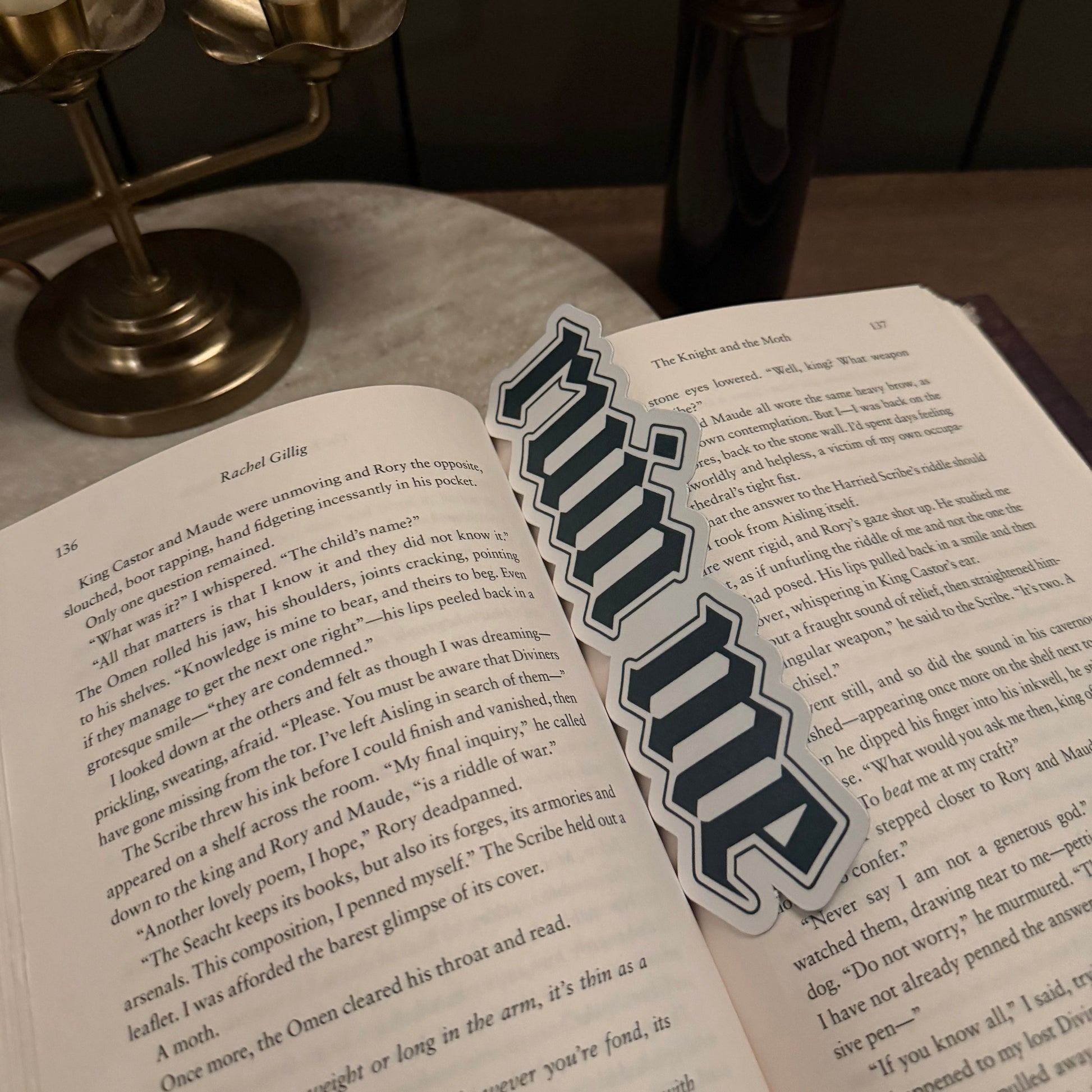 Open book with a sticker labeled 'ruin me' on a wooden surface