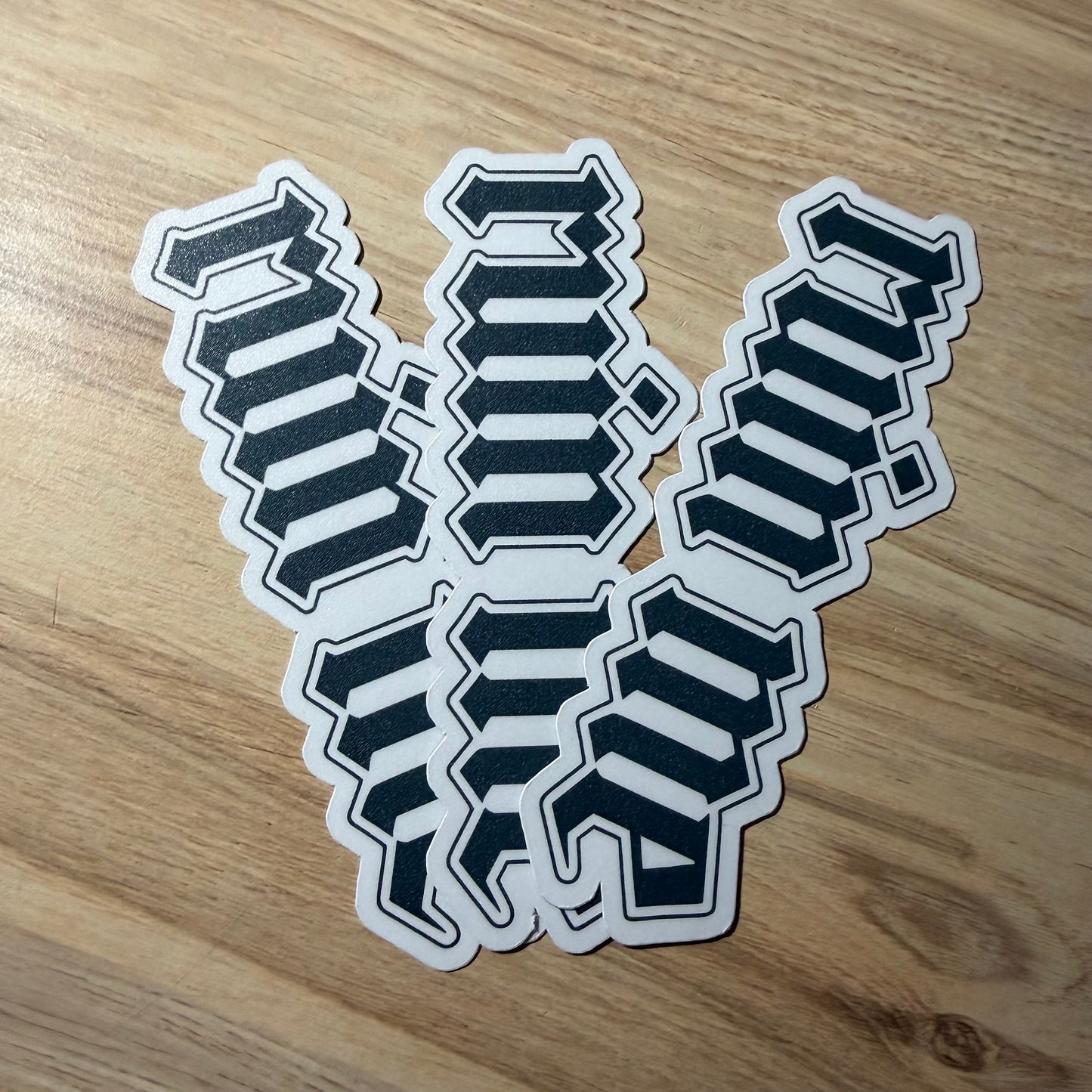 Set of black and white ruin me bookmarks on a wooden surface