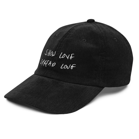 Black cap with white text on a white background