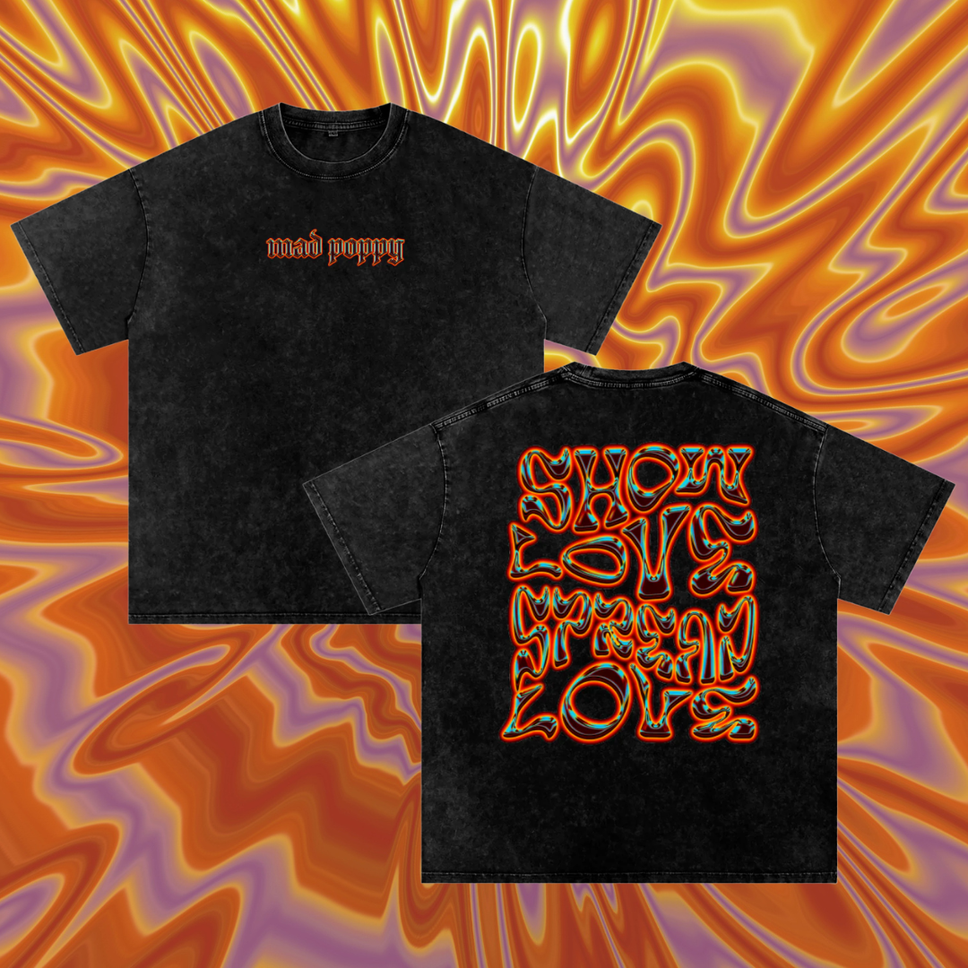 Black t-shirt with colorful text design on a vibrant flame-like background